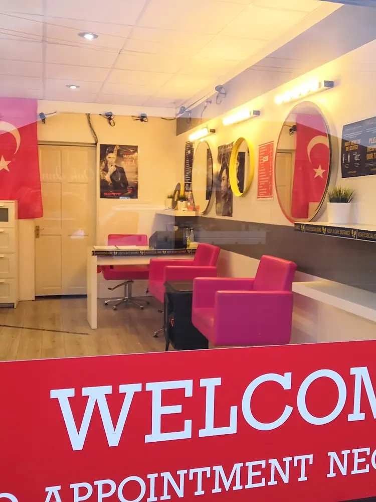 Pink leather chairs, gold-ring mirrors and the Turkish flag inside Sultan Ottoman Turkish Barber